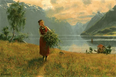 Jeune fille avec des branches de bouleau devant un fjord norvégien